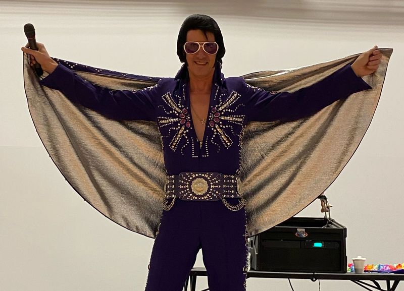 Alan Graveen performing as Elvis in blue jeweled jumpsuit